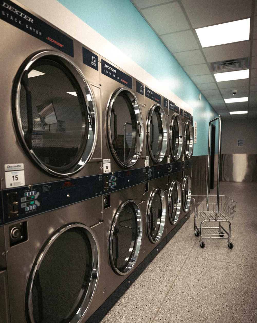 The aisle of stacked dryers at Vic's Wash House