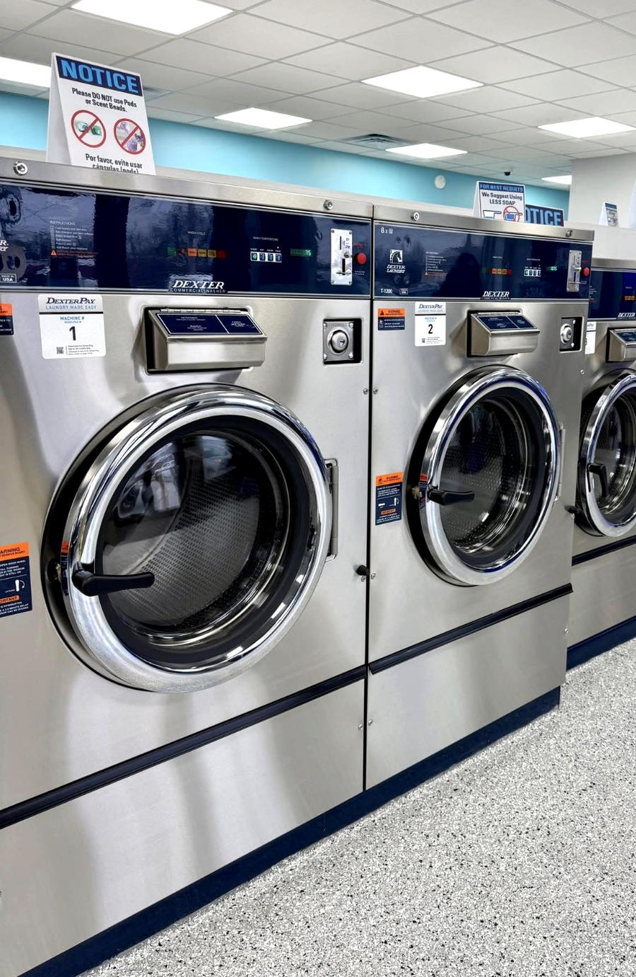 A row of front-loading washers at Vic's Wash House